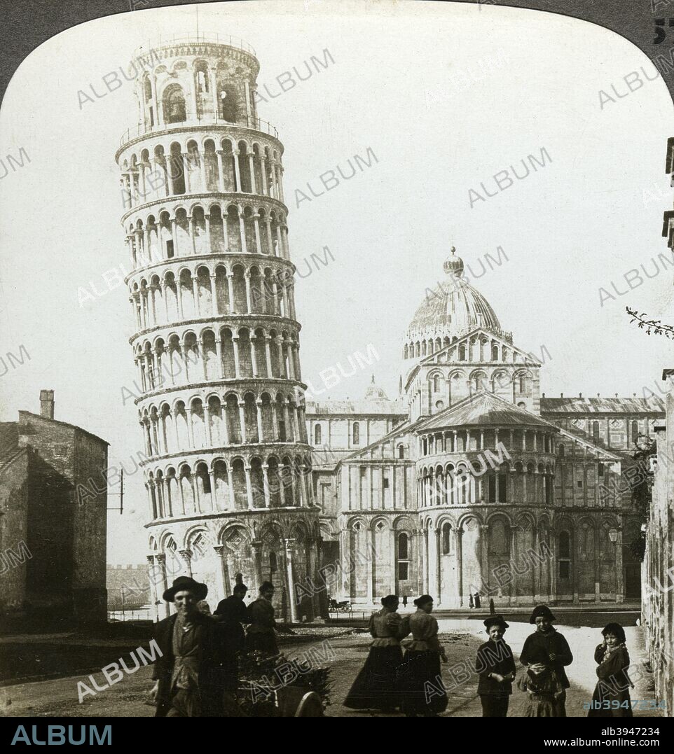 Cathedral and Leaning Tower of Pisa, Italy. The construction of the Romanesque cathedral was begun in the 1060s, the architects being Buschetto and Rinaldo. The final element of the cathedral complex to be built was the campanile, or bell tower, which was begun in 1173. Unfortunately, after construction was under way uneven settling of the foundations caused the tower to lean. Work was suspended several times as solutions were sought, but eventually the leaning tower we see today was completed in the 14th century. The lean contiued to increase at the rate of 1.2mm a year until, by 1990, the tower was in danger of collapsing. The campanile was closed while engineers undertook strengthening work which reduced the lean by 44cm, a project that was completed in 2001. Stereoscopic card detail.