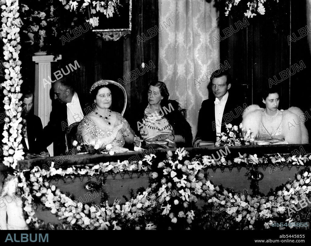 Queen And Princess Margaret At Covent Garden -- The Queen (left foreground) and Princess Margaret (right foreground) seen watching the performance of "Cindrella" at the Royal Opera House, Covent garden, London, evening April 25. The performance was in aid of Sadler's wells ballet benevolent fund. (left to right in box) Lord Porchester, Sir Eric Charles Mieville, Queen Elizabeth, Lady Delia Peel, Capt. Lord Plunkett, Irish guards, temporary equerry to king George VI and Princess Margaret. May 5, 1949. (Photo by Associated Press Photo).