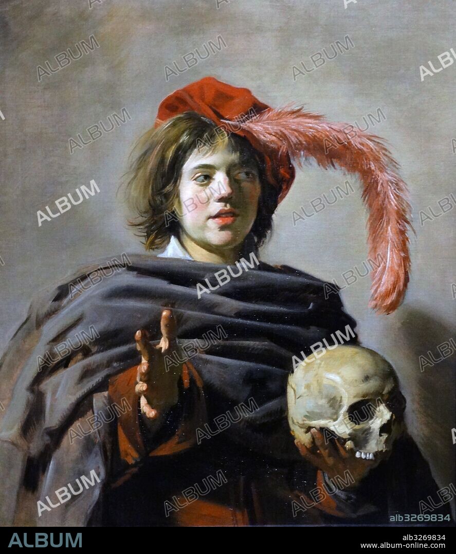 Painting titled 'Young Man holding a Skull (Vanitas) by Frans Hals the Elder (1580-166) Dutch Golden Age portrait painter. Dated 17th Century.