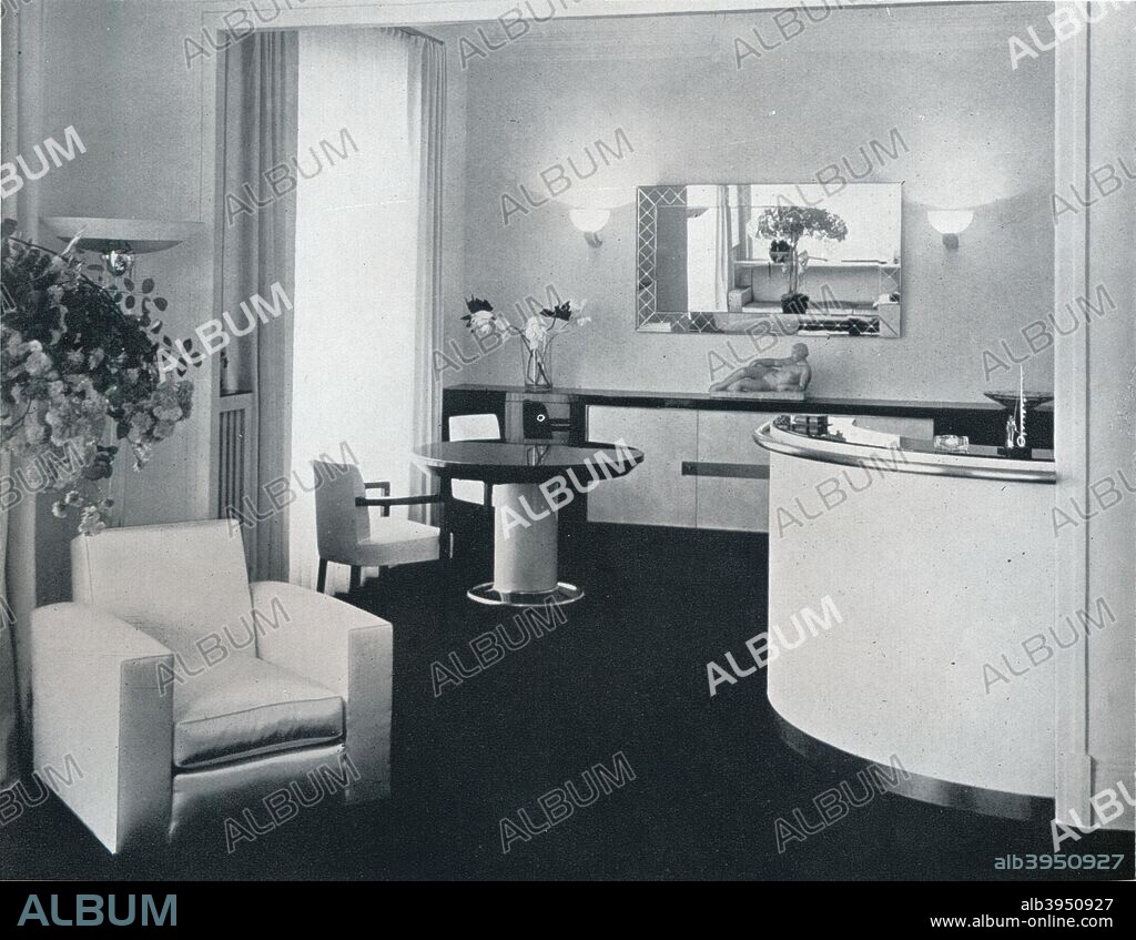 'Bar corner of a dining room designed by Jacques Adnet', c1940. A room designed by Jacques Adnet (1901-1984), French Art Deco modernist designer, architect and interior designer. From The Studio Volume 120. [The Studio Ltd., London & New York, 1940].