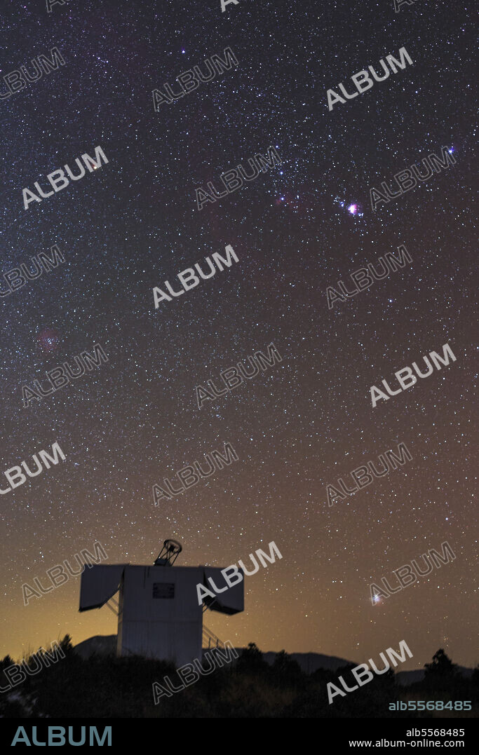 Stars of the constellation Orion and Sirius rise above the BOOTES at the Yunnan Astronomical Observatory in western China. BOOTES, the Burst Observer and Optical Transient Exploring System, is a network of astronomical observatories with sites in Southern Spain, New Zealand and China, devoted to study optical emissions from gamma ray bursts (GRBs) that ocurr in the universe. Also notable in the photograph is Barnard's Loop at the top and Rosette Nebula in the middle left.