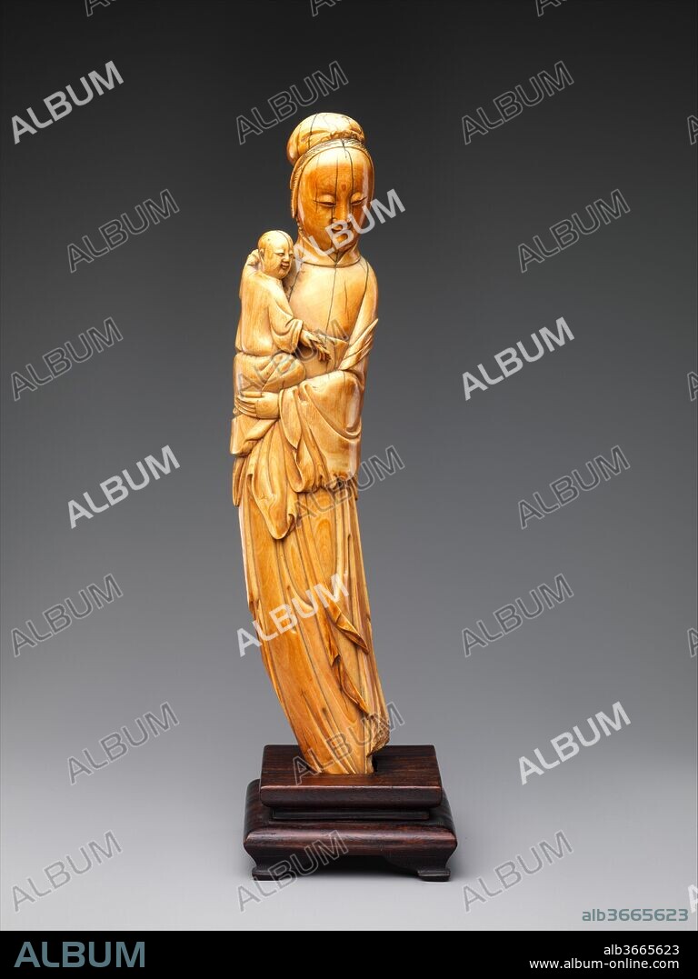 Buddhist deity Guanyin (Bodhisattva Avalokiteshvara). Culture: China. Dimensions: H. 10 1/2 in. (26.7 cm). Date: 16th century.
The child in the arms of the bodhisattva indicates that this ivory carving represents Guanyin as the Bestower of Sons. Although in India the Bodhisattva Avalokiteshvara was originally understood to be either genderless or male, in China, female manifestations developed and become popular, particularly for their ability to provide blessings such as children. This particular form was created during the Ming dynasty (1368-1644).
