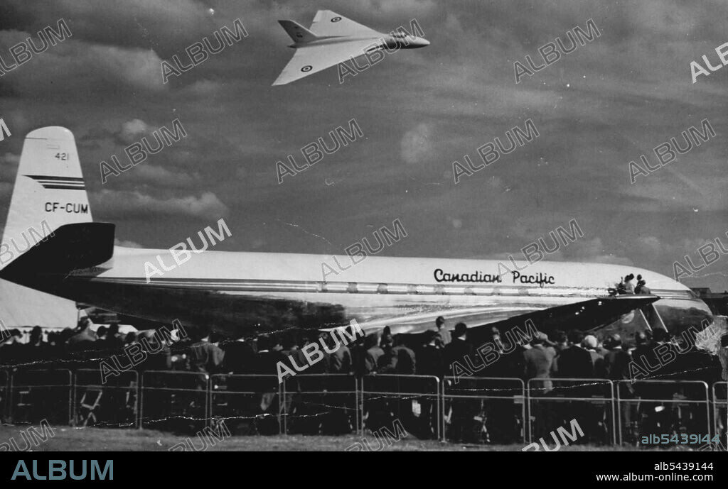 Below it flies above the De Havilland Comet jet liner constructed for Canadian Pacific Airlines, the first sold outside England. September 9, 1952. ;Below it flies above the De Havilland Comet jet liner constructed for Canadian Pacific Airlines, the first sold outside England.