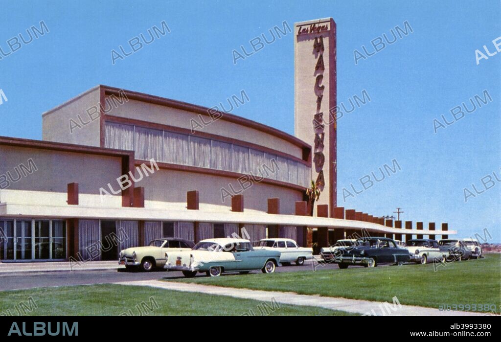 Hacienda Hotel, Las Vegas, Nevada, USA, 1956. Vintage postcard of the exterior of the Hacienda Hotel showing cars parked in the drive. The Hacienda opened on the Las Vegas Strip in 1956. It closed in 1996 and in 1999 the Mandalay Bay Resort and Casino was built on the site.