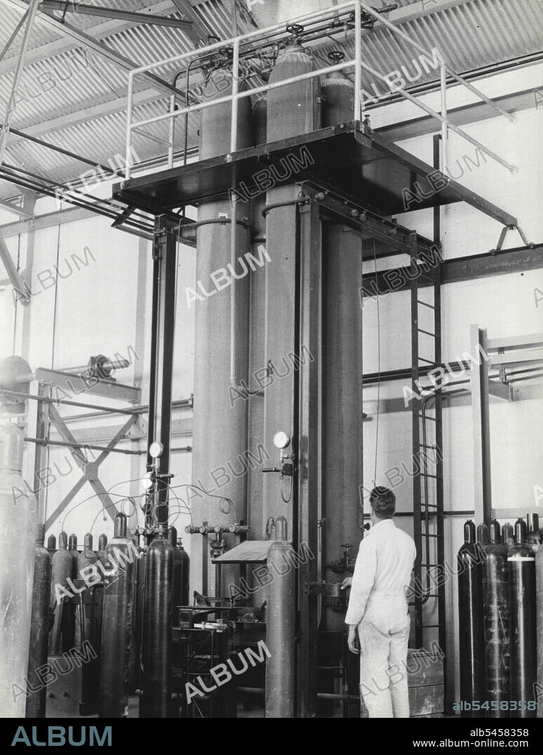 Main liquid CO2 storage tanks. Each of these four tanks holds 1/2 ton liquid. May 24, 1943. (Photo by Alan Evans).