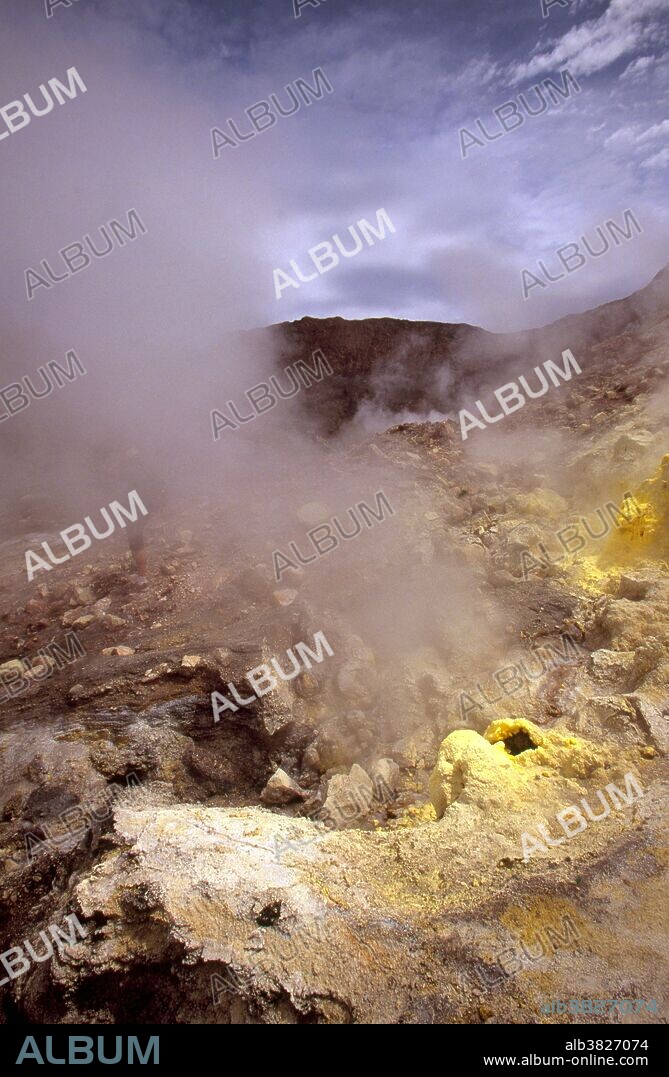 Volcanic fumaroles erupt hot water vapor and gasses. They are usually found at the surface in regions of intense underground thermal activity. As rain water and ground water encounter hot rocks and magma below they flash to steam and erupt through fumaroles. Sulfur mixed into the vapor can cause yellow crystals to harden around the fumarolic vent opening. Fumaroles that contain sulfur are also called solfataras. Fumaroles that spew mostly carbon dioxide, methane or nitrogen are termed Mofettes.