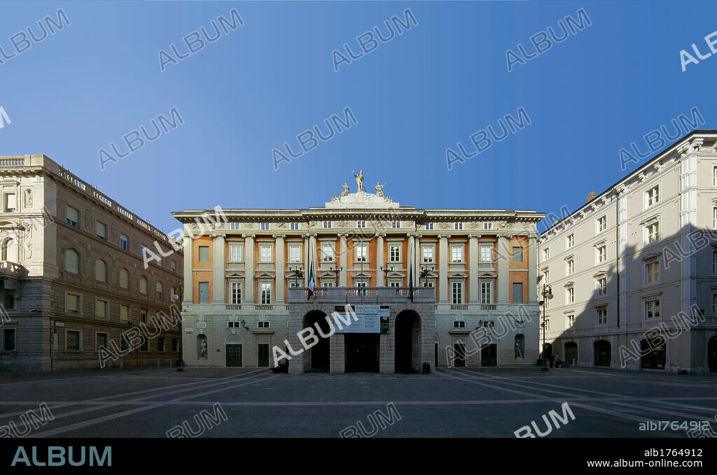 Giuseppe Verdi Municipal Theater (formerly the Grand Theater) in Trieste, by Giovanni Antonio Selva, 1798-1081, 18th Century,. Italy, Friuli Venezia Giulia, Trieste, Giuseppe Verdi Theater. All. View exterior front view facade theater rectangular portico pilasters rustication ashlar work arches monumental architecture half columns Ionic pilaster strips windows rusticated ashlar plinth topping carved facade sculpture square two color effect.