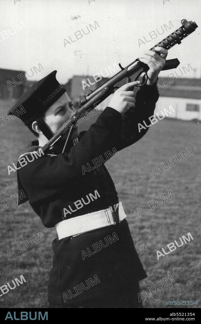 New Weapon For The British Army: A 12 year old see Cadet demonstrates how easy the new Sterling sub-machine gun is to handle. 
A demonstration of the new Sterling sub-machine gun given at Daganham, near London. 
The weapon has now been adopted by the British Army and will be used instead of the Sten gun, and supplementary to the F.N. rifle. 
The Sterling - which weights 6 lbs - is capable of firing at the rate of 575 rounds per minute and can be used either as a fully of semi-automatic sub-machine gun, sighted for accurate shooting up to 200 yards. February 16, 1955.