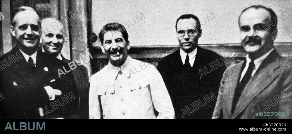 Photographic print of Joachim von Ribbentrop (1893-1946), Joseph Stalin (1878-1953), and Vyacheslav Molotov (1890-1986) meeting to sign the German-Soviet Pact in Moscow. Dated 20th Century.