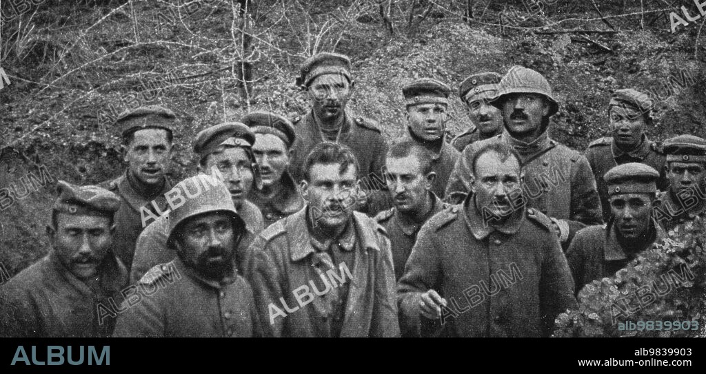 'Notre attaque du 16 avril 1917; Prisonniers dans un boyau, au Godat, a l'Ouest de Reims: notre premiere journee d'offensive nous valut, avec 10,000 prisonniers, les premieres positions allemandes entre Craonne et Soissons et la deuxieme ligne ennemie a l'Est de Craonne', 1917. First World War: 'our attack on 16 April 1917'; (German) prisoners in a trench at Godat, west of Reims...From "L'Album de la Guerre 1914-1919, Volume 2" [L'Illustration, Paris, 1924].