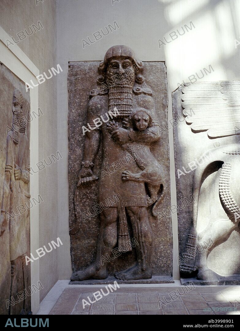 Assyrian sculpture of Gilgamesh holding a lion, Palace of Sargon, Khorsabad, c8th century BC. Part of the collection at The Louvre, Paris.