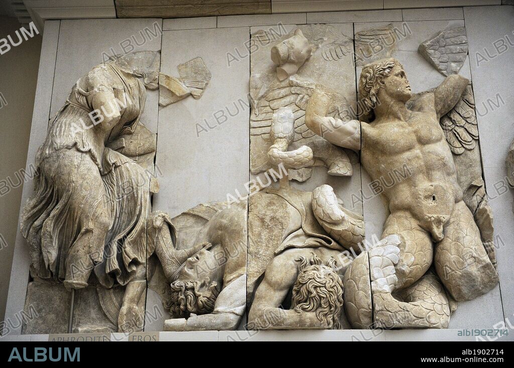 Pergamon Altar. Built by order of Eumenes II Soter. 164-156 BC by artists of the school of Pergamon. Marble and limestone. North frieze. Aphrodite and Eros fighting with a giant. The goddess pulls a lance out of a dead giant. Pergamon Museum. Berlin. Germany.