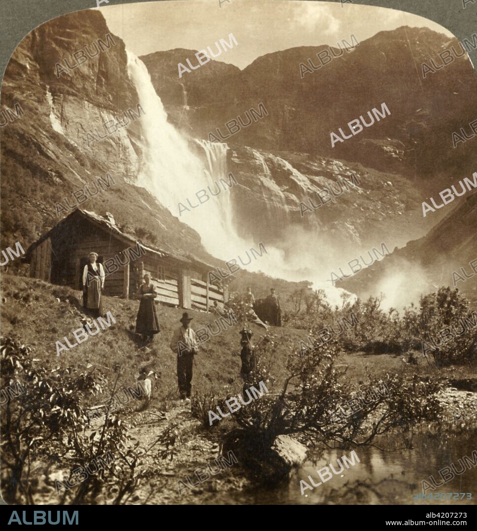 'A humble mountain home at the foot of the cliffs where the Skiaeggedals Falls leap 525 ft., Norway', c1905. From "The Underwood Travel Library - Norway". [Underwood & Underwood, London ].