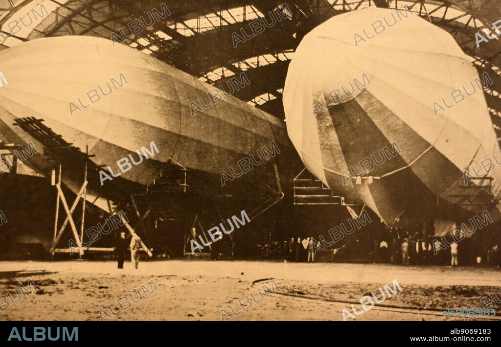 A photograph of two Zeppelins in a hangar. Referred to as "German dreadnoughts of the Air" a Zeppelin is a type of rigid airship created originally from the concepts of Count Ferdinand von Zeppelin in the early 20th century. First flown commercially in 1910, and used extensively as bombers in the First World War by the Germans. Experienced popularity as a method of flight in the 1930's, but the 1937 Hindenburg disaster, as well as political/economic issues, began the downturn in use of Zeppelins.