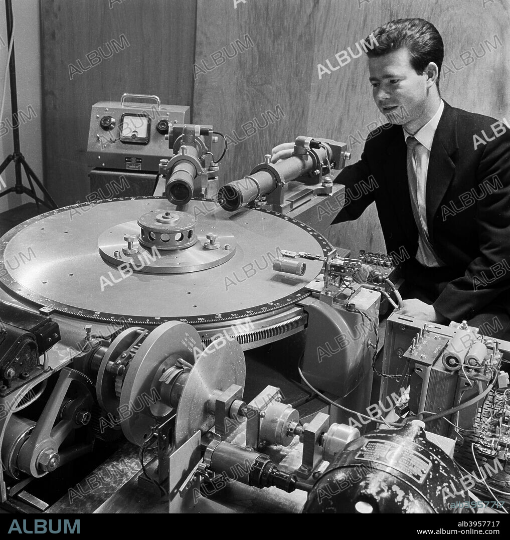 Laboratory at Loughborough University, 1960-1969. A man using electronic scientific equipment and cameras.