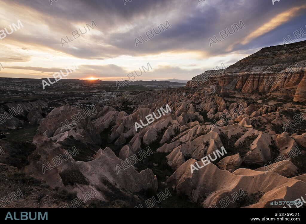 View from Aktepe Hill at sunset over Red Valley, Goreme National Park, UNESCO World Heritage Site, Cappadocia, Anatolia, Turkey, Asia Minor, Eurasia.