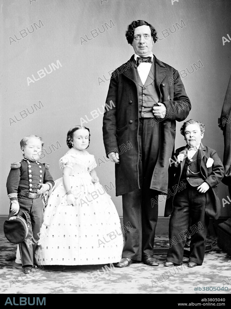 Entitled: "Gen. Tom Thumb, Miss Lavinia Warren, The Giant." Charles Sherwood Stratton (January 4, 1838 - July 15, 1883), "General Tom Thumb", was an American dwarf performer. P.T. Barnum, a distant relative (half fifth cousin, twice removed), heard about Stratton and after contacting his parents, taught the boy how to sing, dance, mime, and impersonate famous people. Barnum took young Stratton on a tour of Europe, making him an international celebrity. His marriage with a little person, Lavinia Warren, became front-page news. The wedding took place at Grace Episcopal Church and the wedding reception was held at the Metropolitan Hotel. The best man at the wedding was Commodore Nutt, another dwarf performer in Barnum's employ. Following the wedding, the couple was received by President Lincoln at the White House. Under Barnum's management, Stratton became a wealthy man. He owned houses, a steam yacht, and he had a wardrobe of fine clothes. When Barnum got into financial difficulty, Stratton bailed him out. Later, they became business partners. Stratton made his final appearance in 1878. He died unexpectedly of a stroke in 1883, at the age of 45. Over 20,000 people attended the funeral. Part of Brady-Handy Photograph Collection. NOTE: Giant not identified.