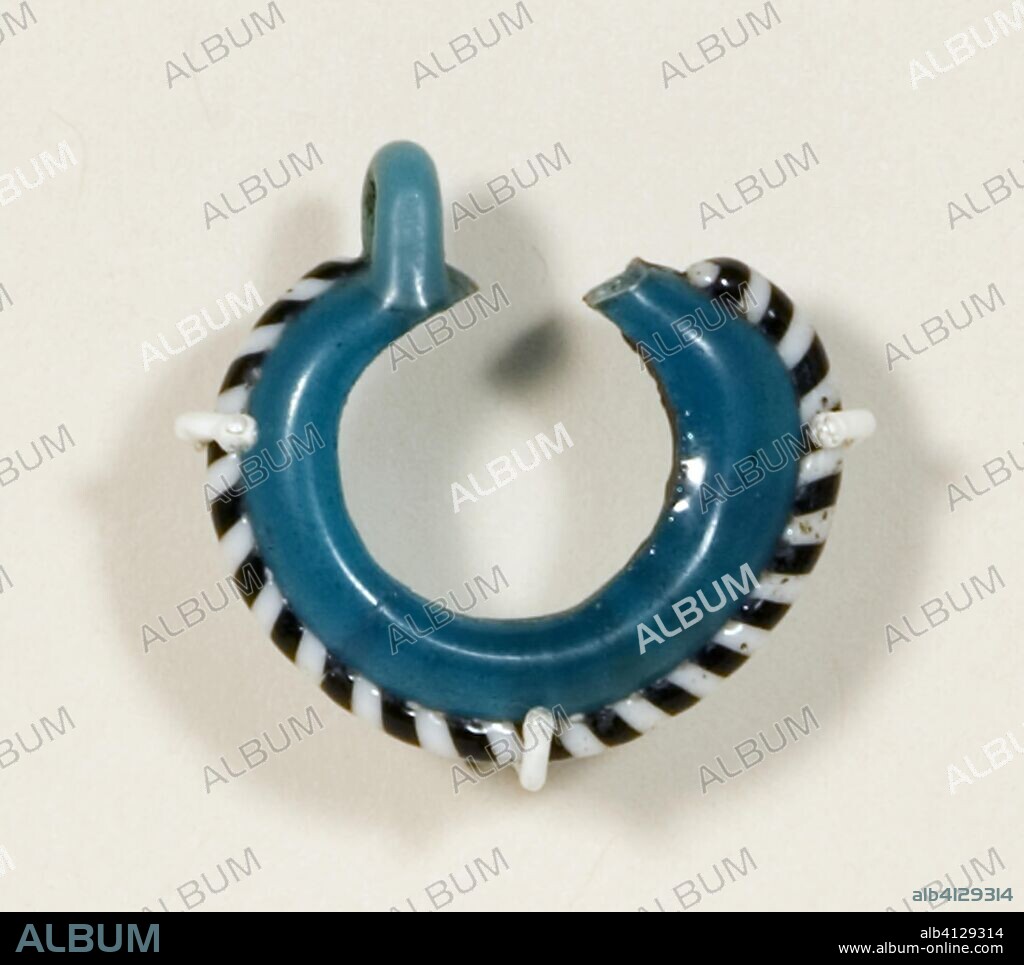 ANCIENT EGYPTIAN. Earring. Egyptian. Date: 1550 BC-1070 BC. Dimensions: 2.6 × 2.7 × 0.6 cm (1 × 1 1/16 × 3/16 in.). Glass. Origin: Egypt.