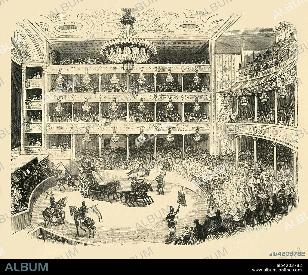 'Interior of Astley's Amphitheatre in 1843', (c1878). Audience watching an equestrian show with a Roman chariot. Philip Astley, the 'father of modern circus', opened his Amphitheatre at Westminster Bridge Road, Lambeth, south London, in 1777. The amphitheatre mixed circus with theatre, having a circus ring attached to a stage and featuring daredevil horseback riding. From Old and New London: A Narrative of Its History, Its People, And Its Places. The Southern Suburbs, Volume VI, by Edward Walford. [Cassell, Petter, Galpin & Co., London, Paris & New York, c1878].