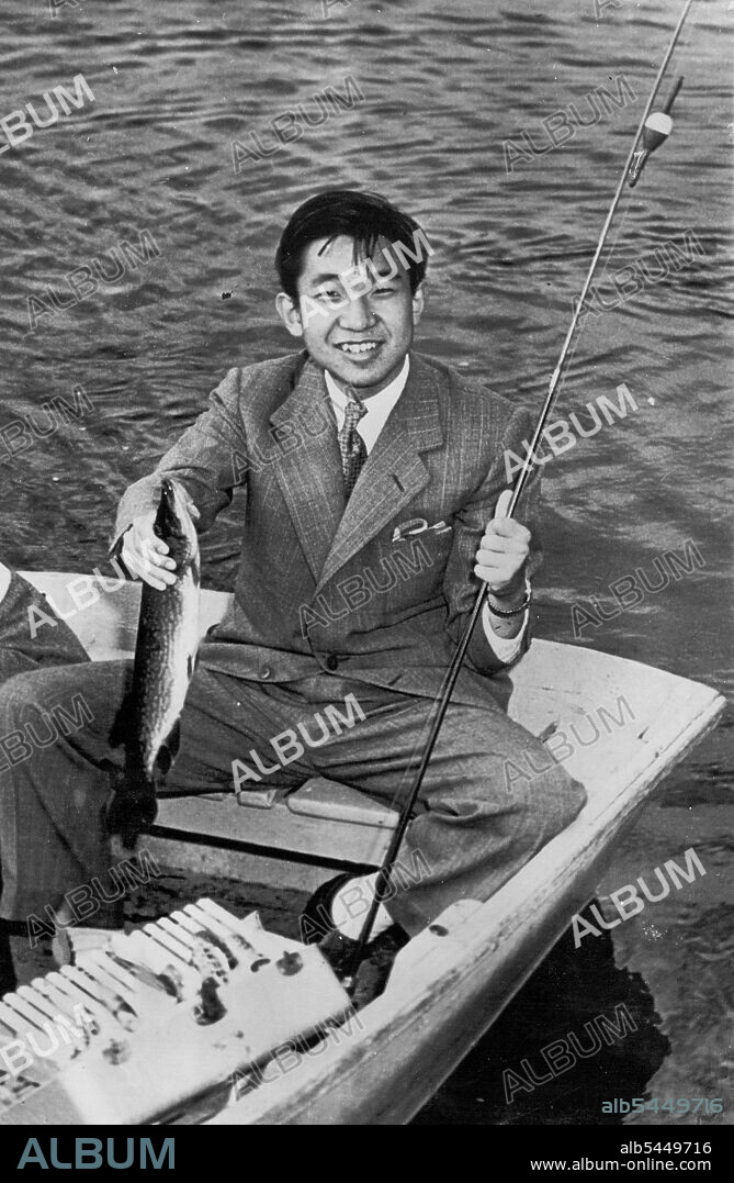 Crown Prince Lands Fish -- The Crown Prince Akihito of Japan smiles holding a 16-inch pickerel he caught while fishing on Naushon Island, off Woods Hole here today. The 19-yr-old Prince proved himself an expert fisherman during the short rowboat trip catching the pickerel, a bass, a perch and three turtles. The Crown Prince's two-day Massachusetts trip will end tomorrow after a visit to Harvard University and a sightseeing tour of Boston. September 20, 1953. (Photo by AP Wirephoto).