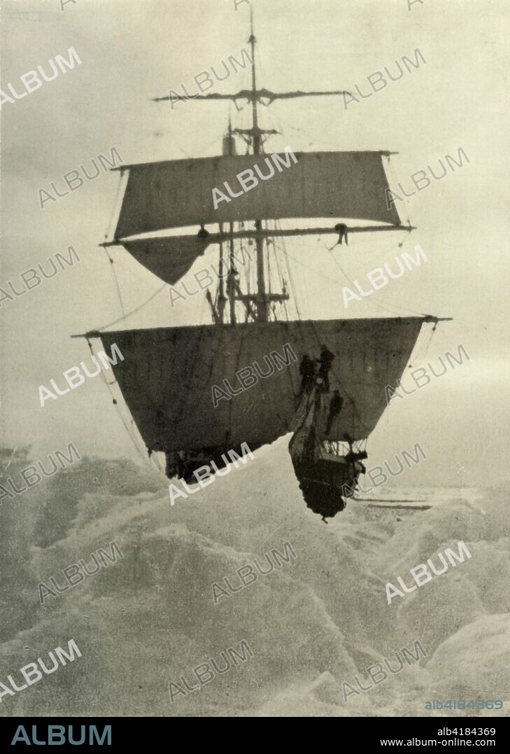 'The Nimrod Held Up in the Ice', 1908, (1909). View over ice looking towards the bows of the sailing ship 'Nimrod' with foresail and upper top set moving into heavy pack ice. Men stand on the bowsprit, shrouds and yard. Anglo-Irish explorer Ernest Shackleton (1874-1922) made three expeditions to the Antarctic. During the second expedition, 1907-1909, he and three companions established a new record, Farthest South latitude at 88°S, only 97 geographical miles (112 statute miles, or 180 km) from the South Pole, the largest advance to the pole in exploration history. Members of his team also climbed Mount Erebus, the most active volcano in the Antarctic. Shackleton was knighted by King Edward VII for these achievements. He died during his third and last 'oceanographic and sub-antarctic' expedition, aged 47. Illustration from The Heart of the Antarctic, Vol. I, by E. H. Shackleton, C.V.O. [William Heinemann, London, 1909].