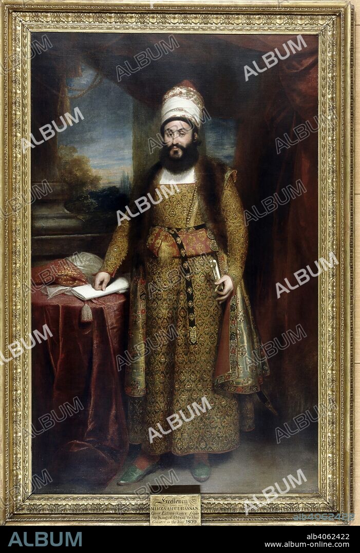 SIR WILLIAM BEECHEY. Mirza Abuâ€™l Hasan Khan, Envoy Extraordinary from the King of Persia to the Court of King George III, 1810 Full-length portrait. A bearded figure standing with one hand on the hilt of his sword and the other resting on a folded document on a red-covered table to the right. He wears a long gold brocade robe with a fur-trimmed sleeveless outer garment, a high turban, red stockings and green morocco slippers. Behind, to the right, of a column, a sunset sky. Oil painting. 92 by 56 ins (234 by 142.5 cms). Source: Foster 26.