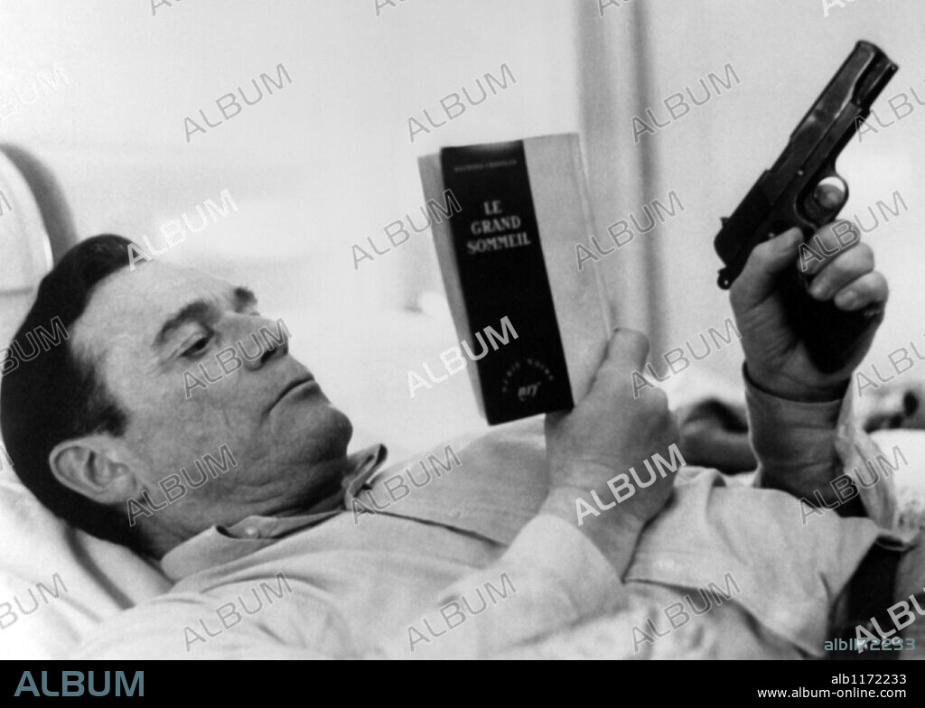 EDDIE CONSTANTINE in ALPHAVILLE, A STRANGE CASE OF LEMMY CAUTION, 1965 (ALPHAVILLE, UNE ETRANGE AVENTURE DE LEMMY CAUTION), directed by JEAN-LUC GODARD. Copyright CHAUMIANE/FILM STUDIO.