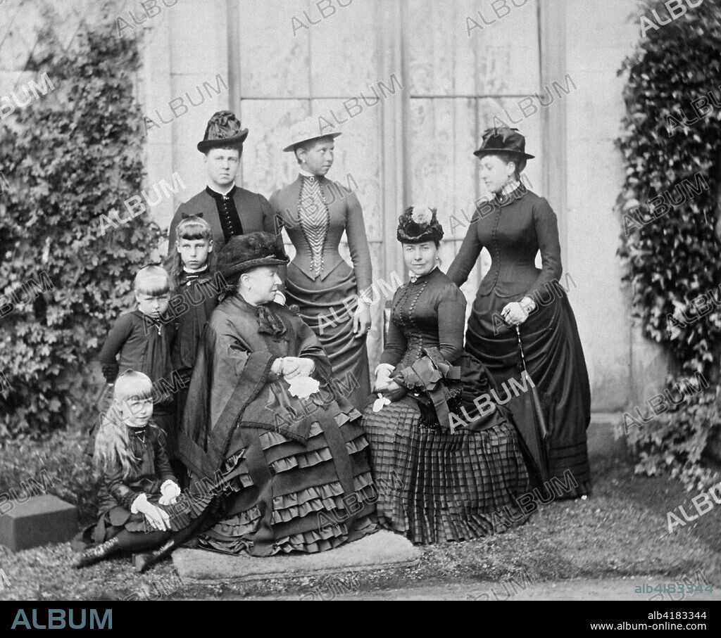 Queen Victoria and her family, Balmoral, Scotland, 1884. Photograph from a Royal Family album at Osborne House, Isle of Wight. Seated (left to right) - on the ground, Princess Marie of Edinburgh (1875-1938), a grandchild of Queen Victoria; Queen Victoria (1819-1901); Princess Victoria, the Princess Royal and Crown Princess of Prussia (1840-1901), Queen Victoria's eldest child. Standing (left to right) - Princess Alexandra of Edinburgh (1878-1942), a granddaughter of Queen Victoria; Princess Victoria Melita of Edinburgh (1876-1936), a granddaughter of Queen Victoria; Duchess of Edinburgh (1853-1920), daughter-in-law of Queen Victoria and mother to the 3 small Princesses; Princess Victoria of Prussia (1866-1929), granddaughter of Queen Victoria; Princess Beatrice (1857-1944), Queen Victoria's youngest child.