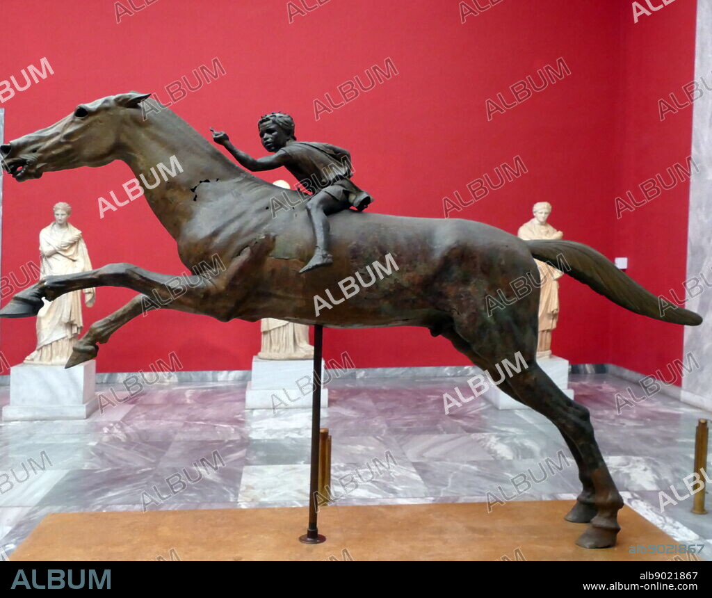 Bronze statue depicting 'The Jockey of Artemision', a large Hellenistic statue of a young boy riding a horse, dated to around 150-140 BC. It is a rare surviving original bronze statue from Ancient Greece and a rare example in Greek sculpture of a racehorse.