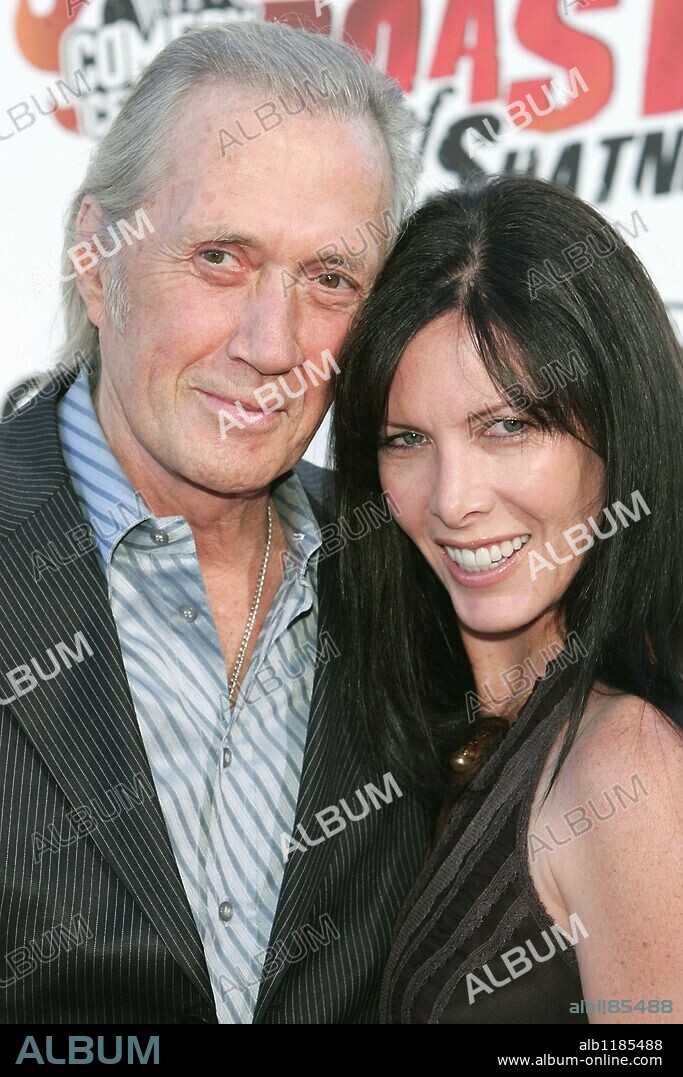 Jun 03, 2009 - Bangkok, Thailand - DAVID CARRADINE aka JOHN ARTHUR CARRADINE (Dec 8, 1936 - Jun 3, 2009), American Actor best known for his work in 'Kill Bill' and Kwai Chang Caine in the 1970's TV series 'Kung Fu' was found dead in his Bangkok hotel room Wednesday. Thai police said a maid found the body of Carradine, 72, in his room, sitting in a wardrobe with a rope around his neck and body. Carradine was filming his latest movie 'Stretch' in Thailand. PICTURED - Aug 13, 2006; Studio City, CA, USA; Actor DAVID CARRADINE and wife ANNIE BIERMAN during arrivals at the Comedy Central Roast of William Shatner at CBS Studios located in Studio City. 03/06/2009
