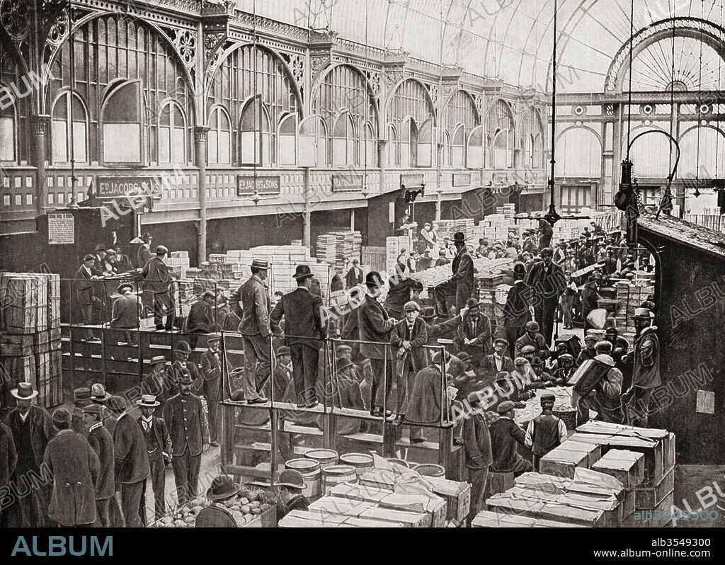 Fruit auctions at Covent Garden fruit and vegetable market, London, England in the late 19th century. From Living London, published c.1901.
