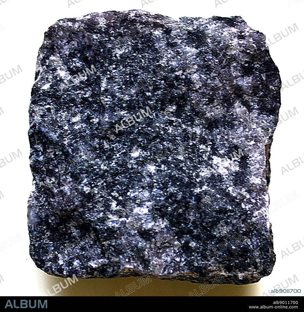 A square of Gabbro, A mafic igneous rock which is dark and coarse grained. Equivalent chemically to Basalt. This rock underlays the vast majority of Earth's surface.