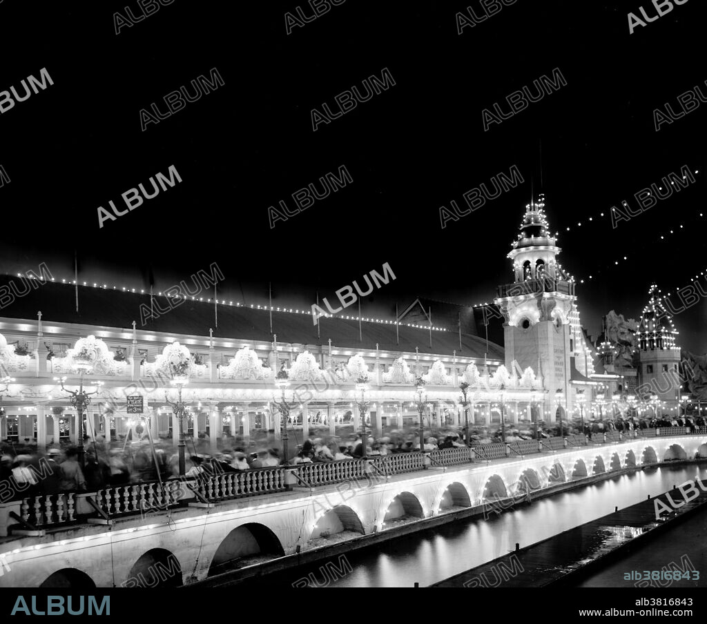 Luna Park was an amusement park in Coney Island located on the north side of Surf Avenue on a site between 8th street, 12th street and Neptune Avenue. The park's architectural style was an Oriental theme with buildings built on a grand scale and over 1,000 red and white painted spires, minarets and domes. At night all the domes, spires and towers were lit with over 250,000 electric lights. At the center of the park in the middle of a lake was the 200 foot tall Electric Tower that was decorated with twenty thousand incandescent lamps. At the base of the tower was a series of cascading fountains. Luna Park turned on its lights and opened its gates to a crowd of 60,000 spectators precisely at 8:05pm on May 16, 1903, coinciding with the timing of sunset on that Saturday night. The park was mostly destroyed by a fire in 1944. Photographed by the Detroit Publishing Company, 1903-06, 1900s, 20th century.
