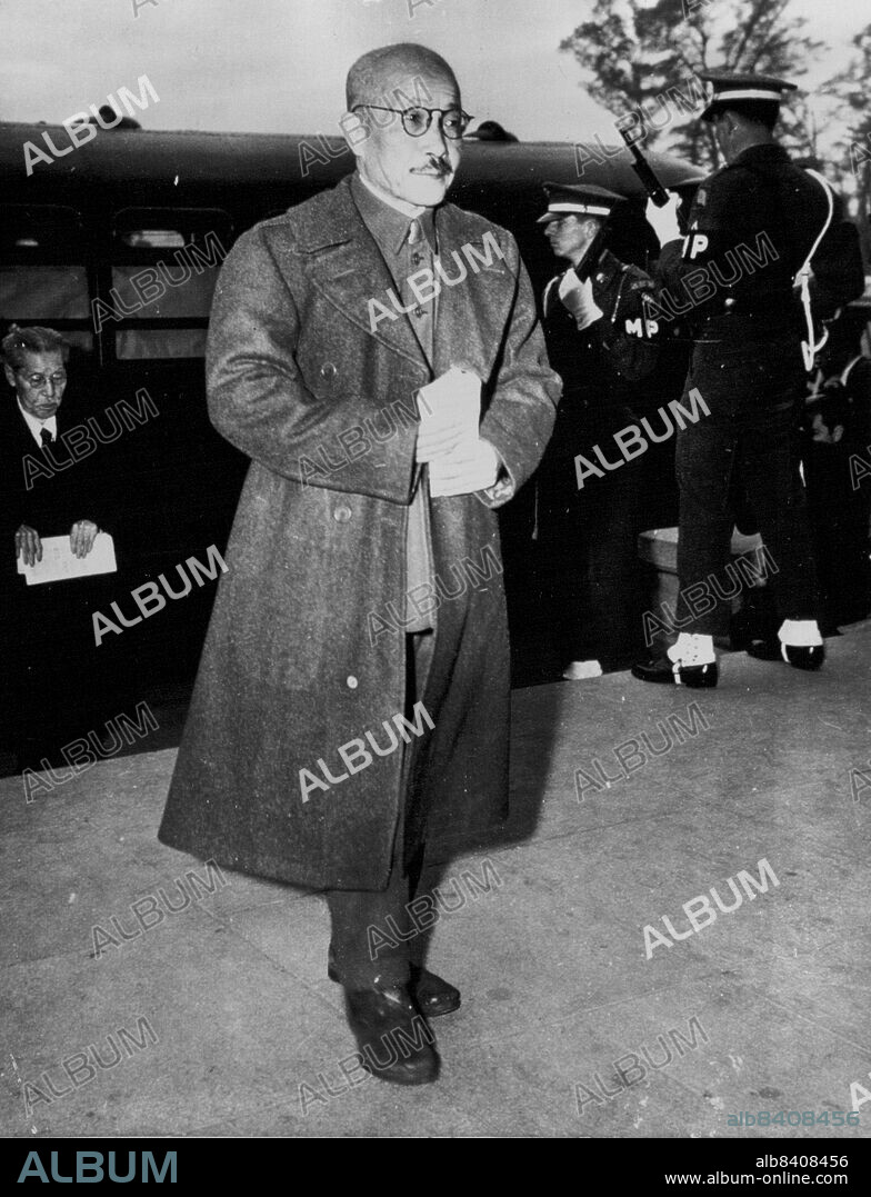 Tojo Arrives for Sentence -- Hideki Tojo, former Prime Minister and War Minister of Japan, leaves a heavily guarded bus at the International Military Tribunal, Far East, building in Tokyo, Nov. 12 to hear the death sentence pronounced. November 14, 1948. (Photo by AP Wirephoto).
