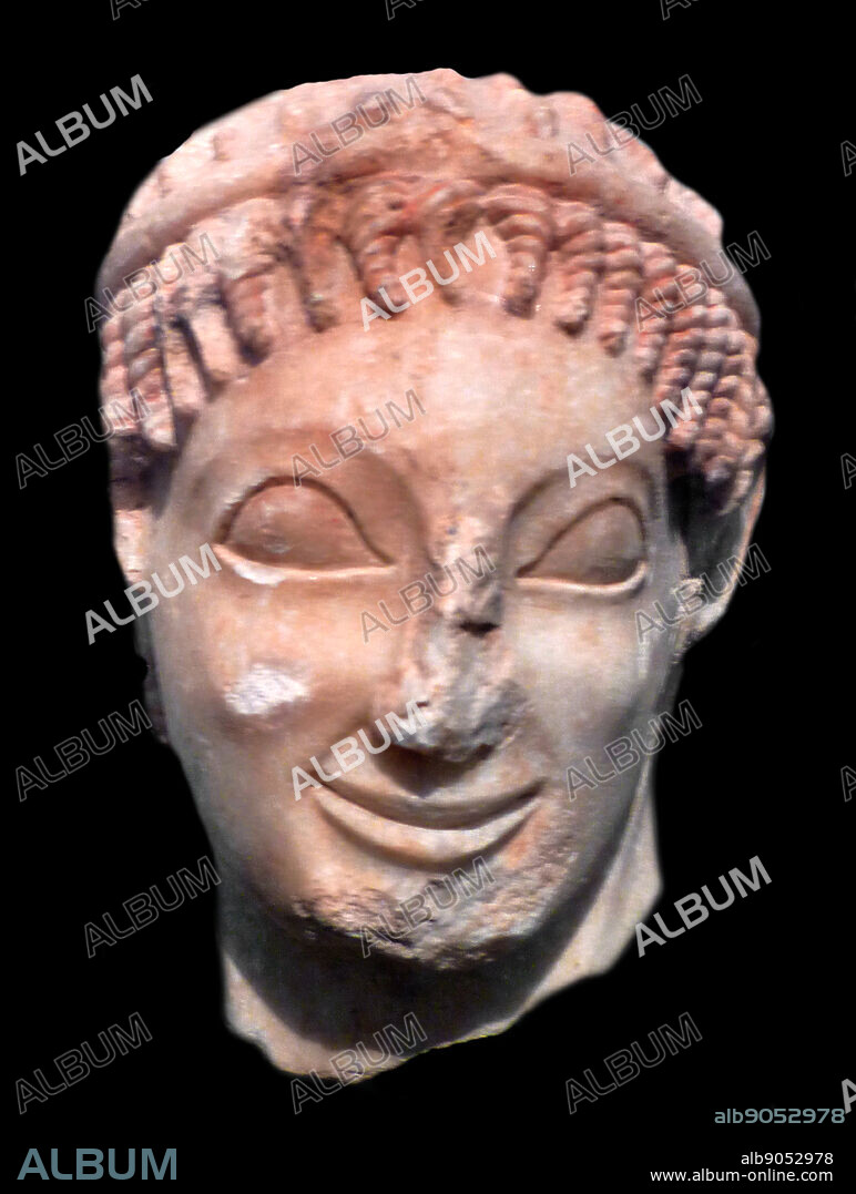 Head of a youth. Marble. Found in Eleusis. probably belonging to the statue of a rider. About 560 B.C. National Archaeological Museum of Athens.