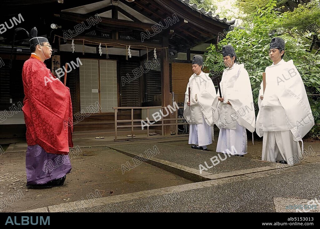 Shinto priests carrying scepters and wearing hats, Nashinoki Shrine, Kyoto, Japan, East Asia, Asia.