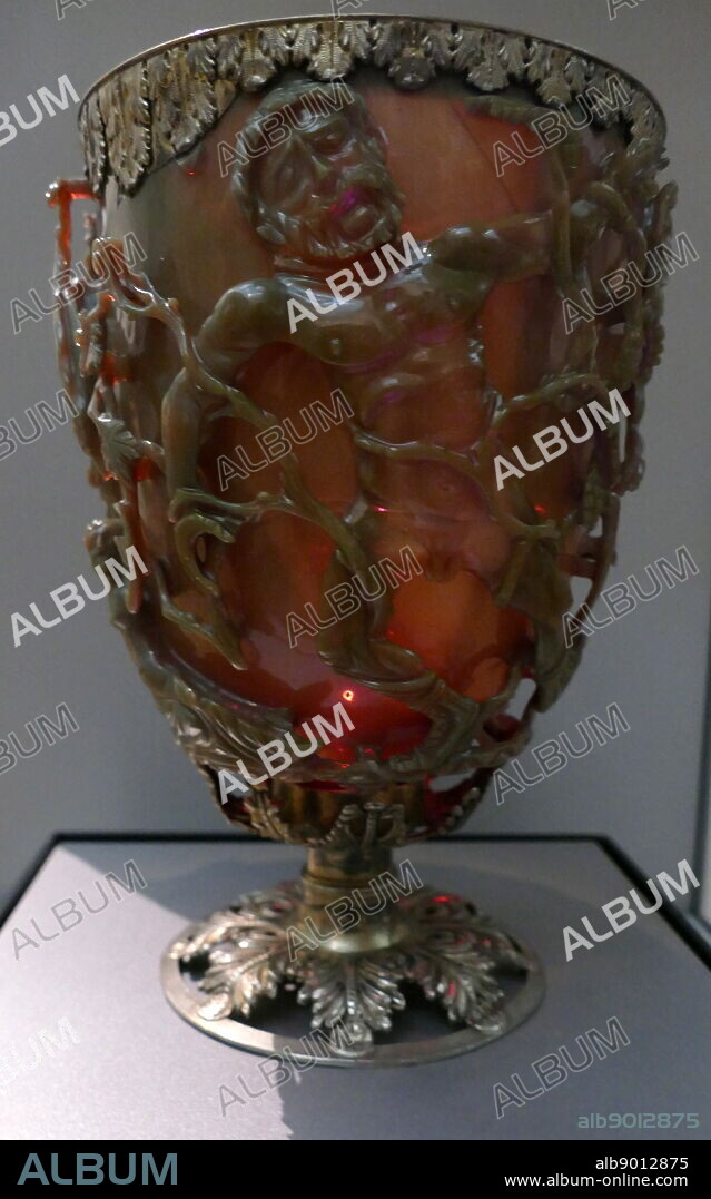 The Lycurgus Cup; 4th-century, Roman glass cage cup. Made of a dichroic glass, which shows a different colour depending on whether or not light is passing through it; red when lit from behind and green when lit from in front. It is the only complete Roman glass object made from this type of glass. The cup is also a very rare example of a complete Roman cage-cup, or diatretum. It named after King Lycurgus.