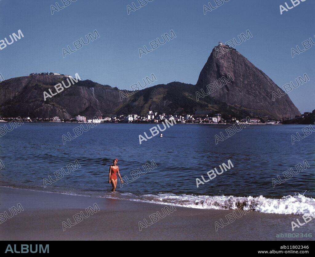 Rio de Janeiro in Brasil - Rio de Janeiro (meaning River of January in Portuguese) is the name of both a state and a city in southeastern Brazil. Commonly known as just Rio (particularly in English), the city is considered by many to be among the most beautiful cities in the world. It is famous for the hotel-lined tourist beaches Copacabana and Ipanema, for the giant statue of Jesus, known as Christ the Redeemer ("Cristo Redentor") on the Corcovado mountain, and for its yearly Carnival celebration. It also has the biggest forest inside an urban region, called Floresta da Tijuca, or "Tijuca Forest". It is Brazil's second-largest city after São Paulo and was the country's capital until 1960, when Brasília took its place. Residents of the city are known as cariocas. - ©TopFoto.