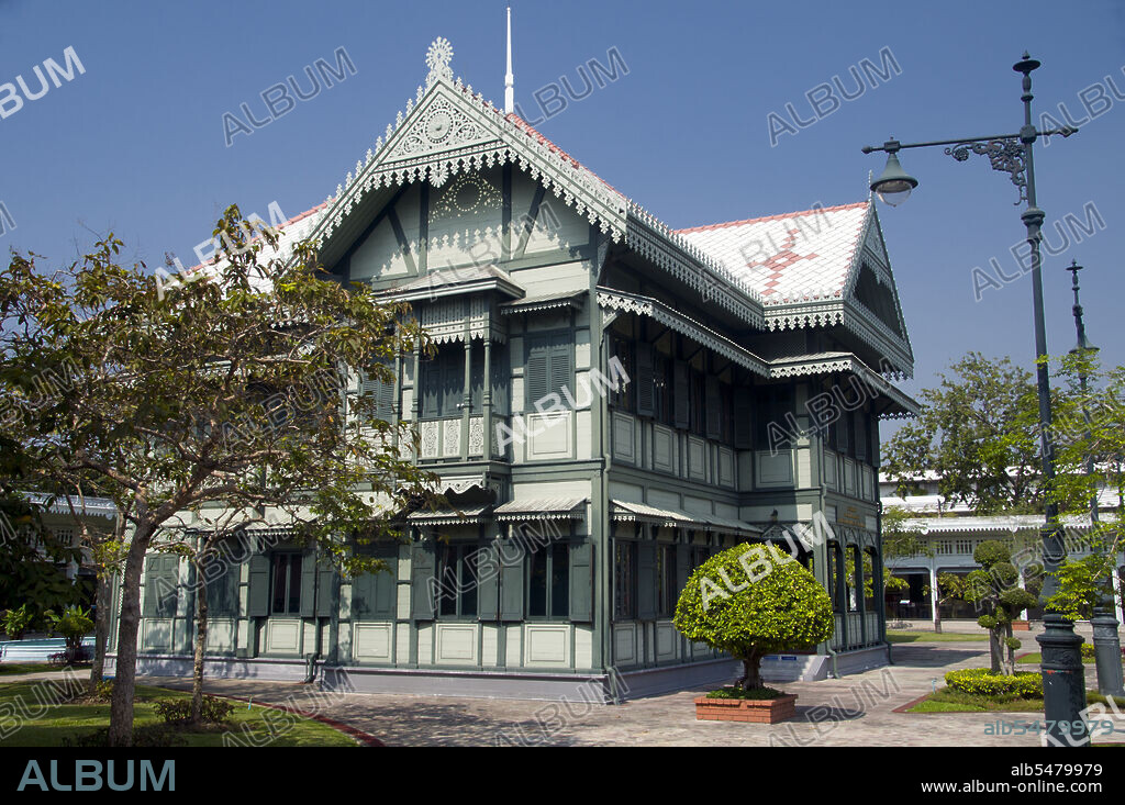 The Suan Hong Residential Hall was originally built by King Chulalongkorn (Rama V) for his grandmother, Queen Savang Vadhana. This old wooden two storey building now houses pictures portraying key events in the life of King Bhumibol Adulyadej (Rama IX), the present King of Thailand. The Vimanmek Mansion is a former royal palace and is also known as the Vimanmek Teak Mansion or Vimanmek Palace. Vimanmek Mansion was built in 1900 by King Rama V (King Chulalongkorn) by having the Munthatu Rattanaroj Residence in Chuthathuj Rachathan at Ko Sichang, Chonburi, dismantled and reassembled in Dusit Garden. It was completed on March 27, 1901 and used as a royal palace by King Rama V for five years. In 1982 Queen Sirikit asked permission of King Rama IX (Bhumibol Adulyadej) to renovate Vimanmek Palace for use as a museum to commemorate King Rama V by displaying his photographs, personal art and handicrafts. The palace is the world's largest golden teakwood mansion.