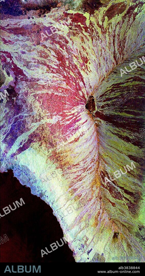 This image of the Mauna Loa volcano on the Big Island of Hawaii shows the capability of imaging radar to map lava flows and other volcanic structures. Mauna Loa has erupted more than 35 times since the island was first visited by westerners in the early 1800s. The large summit crater, called Mokuaweoweo Caldera, is clearly visible near the center of the image. Leading away from the caldera (towards top right and lower center) are the two main rift zones shown here in orange. Rift zones are areas of weakness within the upper part of the volcano that are often ripped open as new magma (molten rock) approaches the surface at the start of an eruption. The most recent eruption of Mauna Loa was in March and April 1984, when segments of the northeast rift zones were active. If the height of the volcano was measured from its base on the ocean floor instead of from sea level, Mauna Loa would be the tallest mountain on Earth. Its peak (center of the image) rises more than 8 kilometers (5 miles).