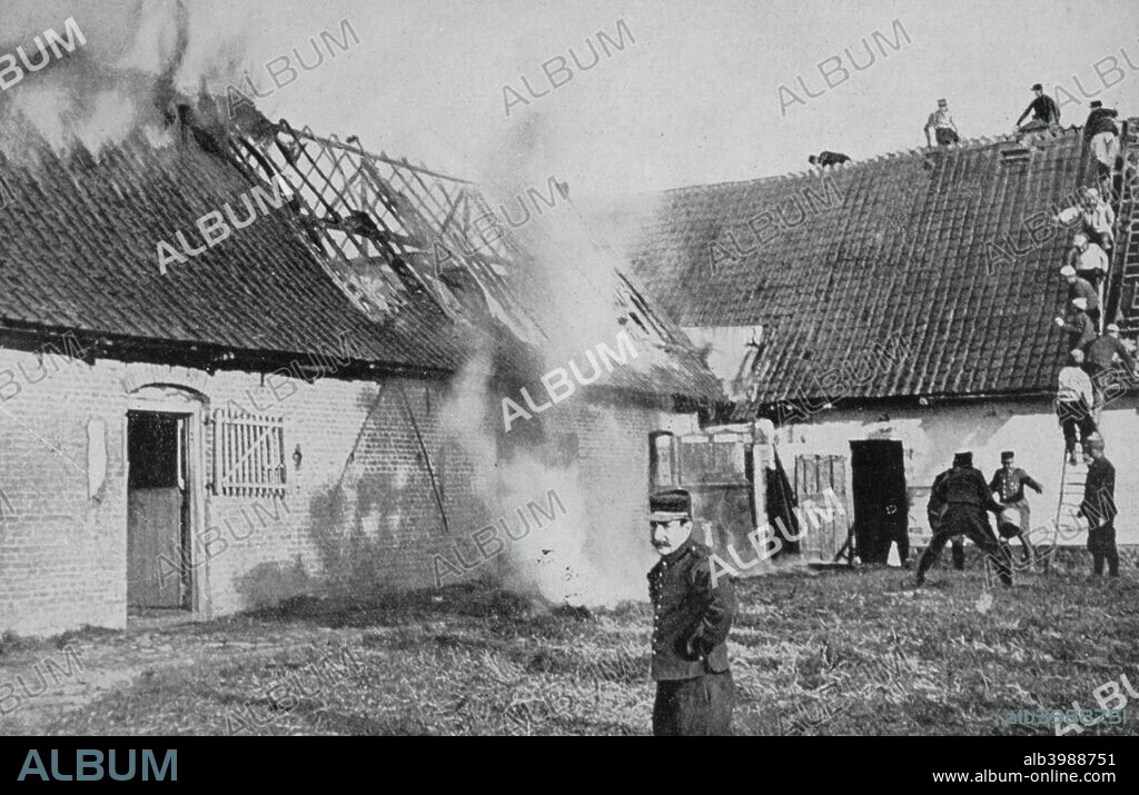 French soldiers fight a fire started by German incendiary bombs, Artois, World War I, 1915. During World War I the front line between the opposing German and British armies in France ran through the province, resulting in enormous physical damage. A print from Le Flambeau, 1915.