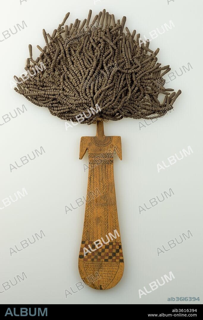 Paddle Doll. Dimensions: Body: H. 22.8 cm (9 in.); W. 7 cm (2 3/4 in.); Th. 0.9 cm (3/8 in.). Dynasty: Dynasty 11, late-12. Date: ca. 2030-1802 B.C..
The so-called paddle doll consists of a flat piece of wood depicting the torso, rudimentary arms and neck of a woman, with a thick shock of "hair" made of beads strung on linen thread.  The body is often painted with jewelry, textile patterns and/or tattoos.  Contrary to their modern name, these "dolls" were not toys.  The key-hole shape of the body is similar to the counterpoise of the menat necklaces that were used as percussion instruments during religious ceremonies (see 11.215.450) .  When shaken, the beads of the menat necklace would have made a sound intended to appease a god or goddess.  The paddle dolls, with their beaded hair, may have served the same purpose.  It has been suggested that paddle dolls were an accoutrement of troops of singers and dancers who performed at religious ceremonies associated with the goddess Hathor.