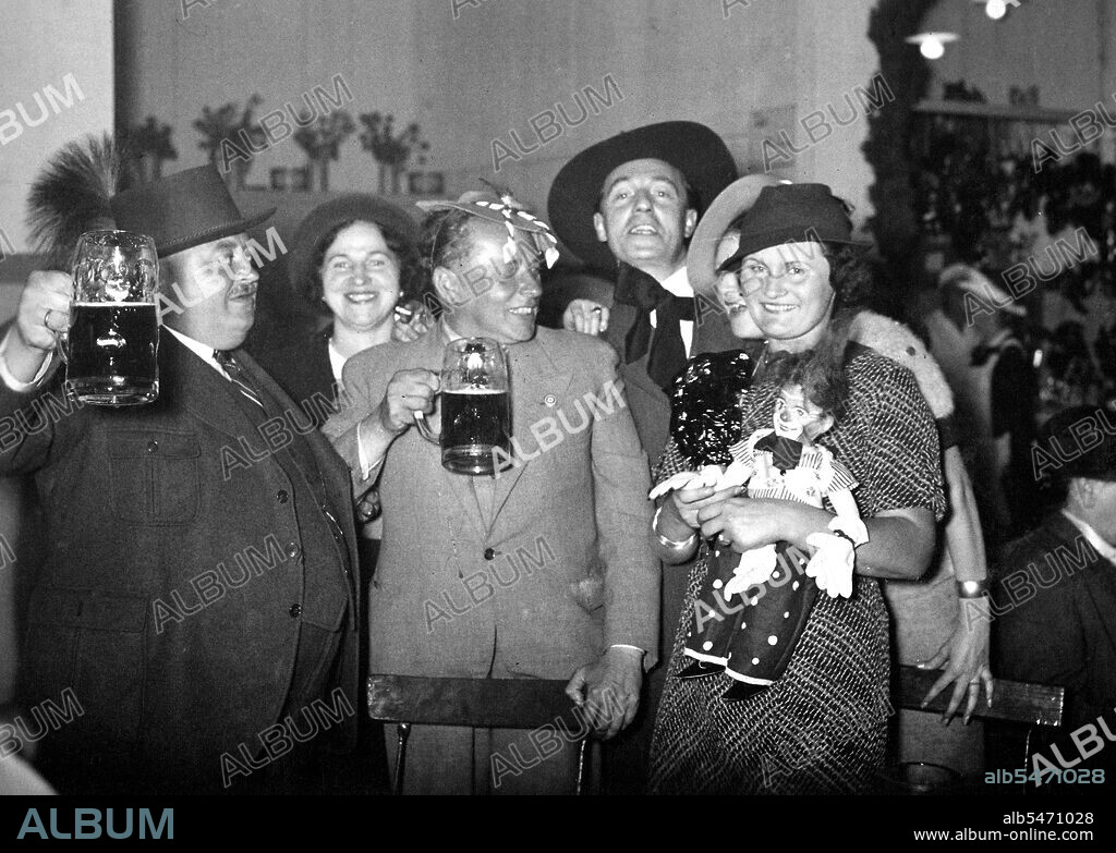 German men drinking beer and celebrating circa 1930s (possibly around Christmas or New Years) .