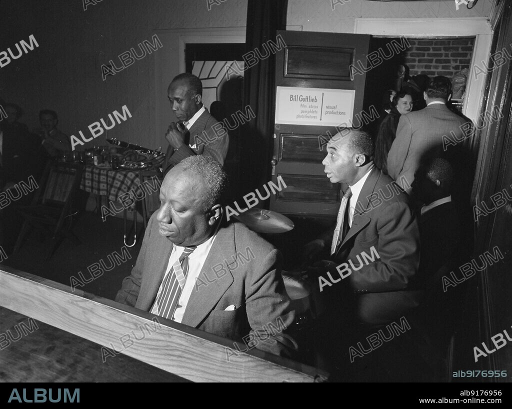 WILLIAM PAUL GOTTLIEB. Portrait of James P. (James Price) Johnson, Fess Williams, Freddie Moore, and Joe Thomas, William P. Gottlieb's office party, Jamaica, Queens, New York, N.Y., ca. 1948.