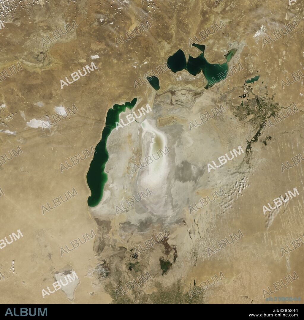 Satellite image of the shrinking of the Aral Sea taken in 2009. The Aral Sea, is a lake lying between Kazakhstan, in the north and Uzbekistan in the south. The name roughly translates as 'Sea of Islands', referring to over 1,100 islands that once dotted its waters; Formerly one of the four largest lakes in the world with an area of 68,000 km2 (26,300 sq mi), the Aral Sea has been steadily shrinking since the 1960s after the rivers that fed it were diverted by Soviet irrigation projects.