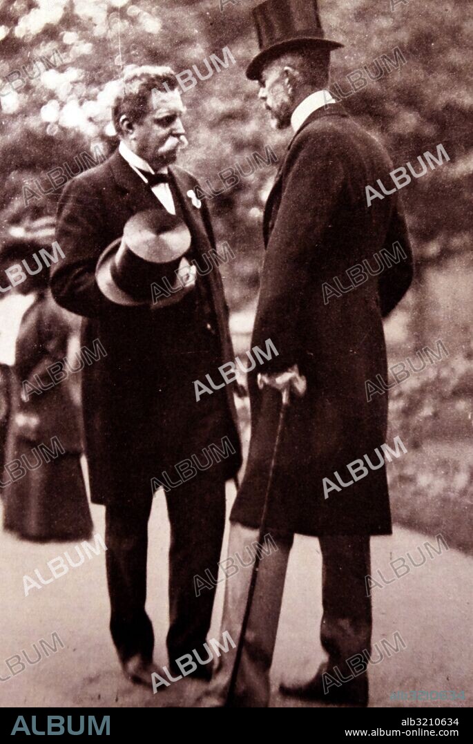 Photographic print of King Gustaf V of Sweden (1858-1950) and Hjalmar Branting (1860-1925) a Swedish politician, former Prime Minister, and leader of the Swedish Social Democratic Party, at a garden party in Logarden at the Royal Palace. Dated 20th Century.