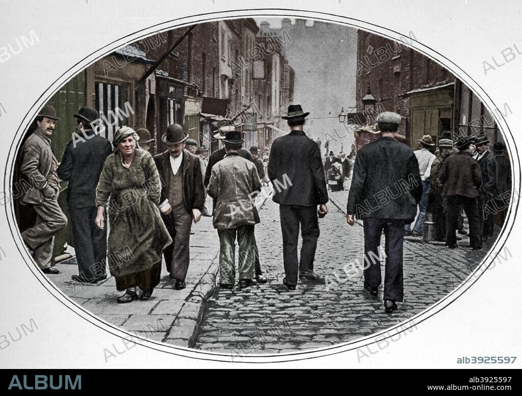 Main street of the Italian community, Clerkenwell, London, c1900 (1901). In the 1850s the south-western part of Clerkenwell became known as 'Little Italy' because of the Italian immigrant community that settled there. From Living London, Vol. 1, edited by George R. Sims. [Cassell and Company, Limited, London, Paris, New York & Melbourne, 1901]. (Colorised black and white print).