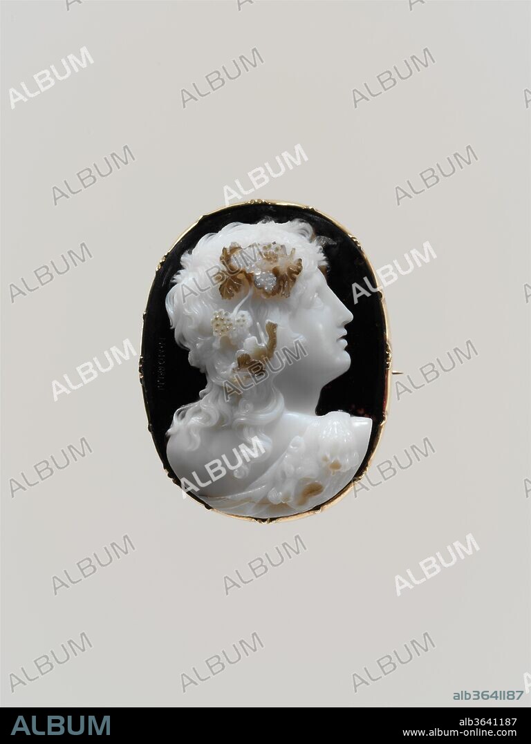 Bust of a bacchante. Artist: Nicola Morelli (Italian, 1771-1838). Culture: Italian, Rome. Dimensions: Overall (confirmed): 1 3/4 x 1 5/16 in. (4.4 x 3.4 cm); visible cameo: 41.7 x 32.5 mm. Date: 1820-38.
In these cameos of devotees of Bacchus, Nicola Morelli, a shrewd judge of the coloristic capacities of hardstones, did not merely copy himself: In the gem on the left (40.20.44), with a goatskin and more complex tresses, he exploited four strata, the topmost being the pink of the grapes. In that on the right (40.20.45), in three layers, he investigated the uppermost layer of brown to define the grapevine against the pallid flesh of the girl, who seems even less in control of her senses.