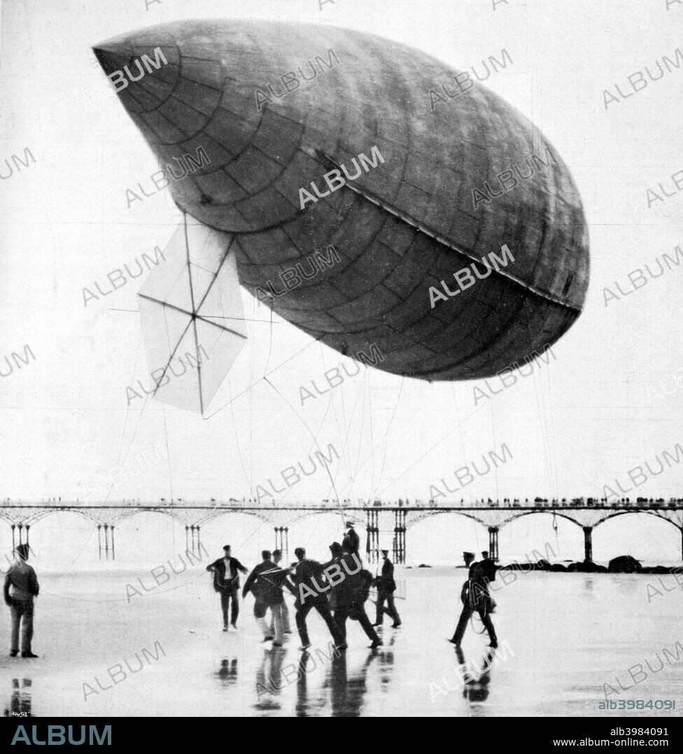 Santos-Dumont's airship departing from Trouville, France, 1905. Alberto Santos-Dumont was a Brazilian pioneer aviator. He initially focused on airship design, famously flying around the Eiffel Tower in 1901, but later switched to building fixed-wing aircraft. Photograph published in La Vie Au Grand Air, 1905.