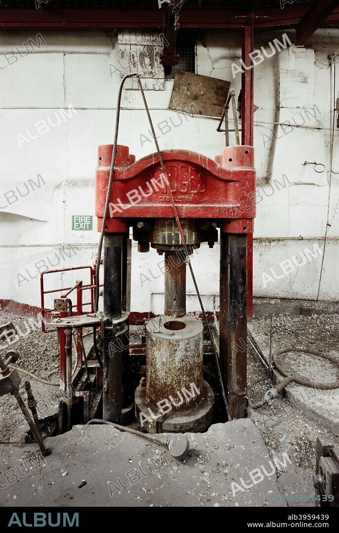 Machinery in the Lead Shot Tower, Cheese Lane, Bristol, 2000. Uniformed shot is produced by pouring lead through a sieve or colander, called a 'card', allowing it to form into spheres as it drops, and then catching it in cold water. Lead from the Mendip hills is rich in arsenic, which lends itself to this process. Lead from elsewhere will often have arsenic added to it to prevent it forming strips or sheets when dropped.